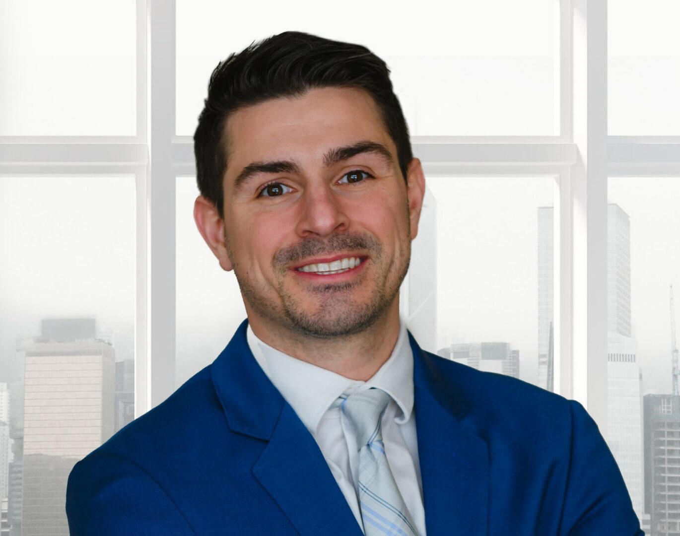 Smiling man in blue suit by window